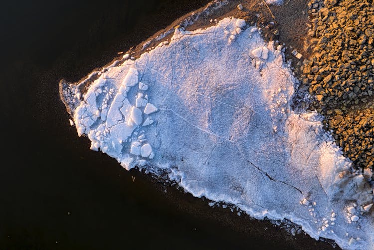 Crumbling Ice And Snow Covering Seashore