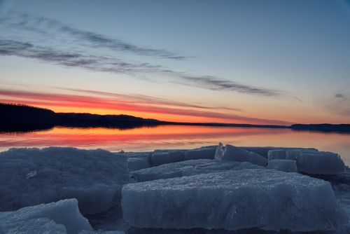 Free Beautiful sunrise over ice-covered Lake Pepin in Lake City, MN, USA. A serene winter landscape full of color and tranquility. Stock Photo