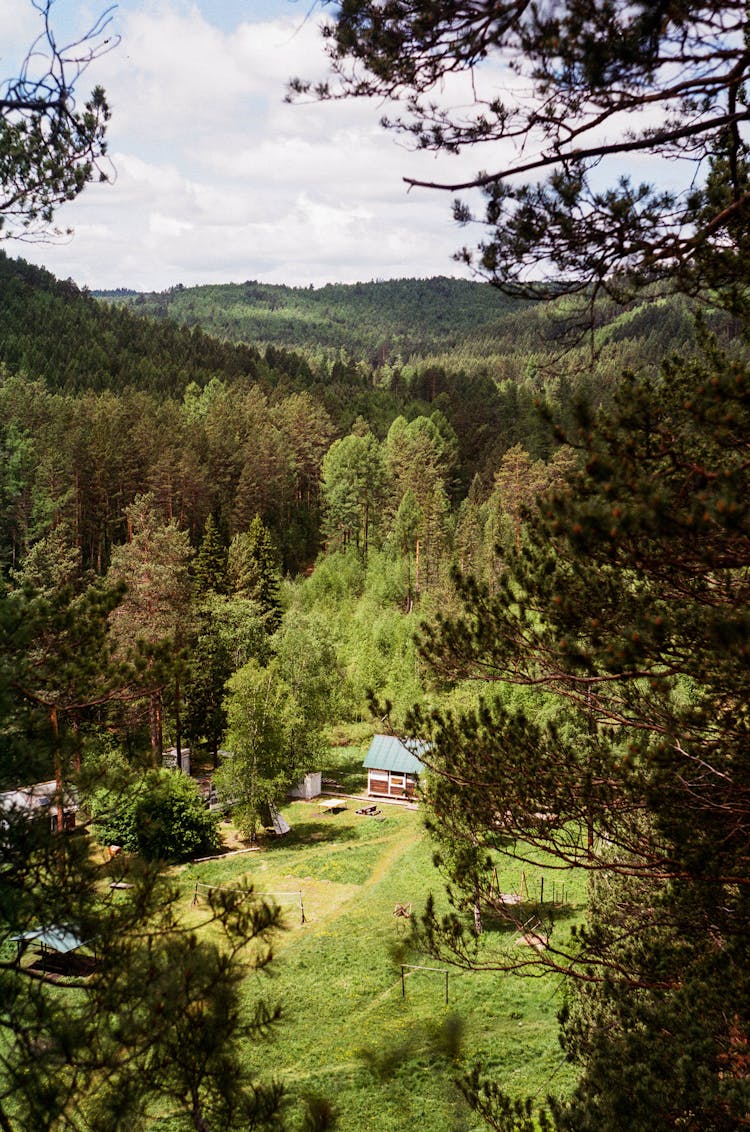 View Of A House In A Forest Valley