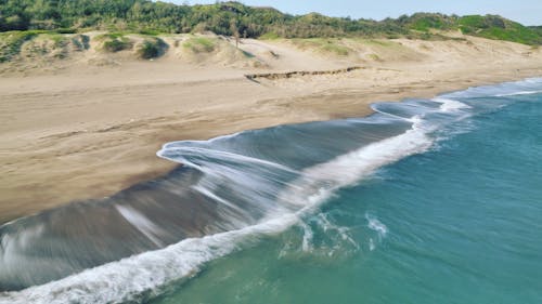 Aerial Photography of Ocean Waves Crashing on the Sea Shore