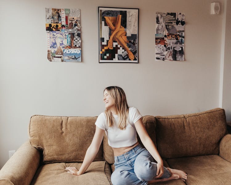 Blond Woman Sitting On Couch