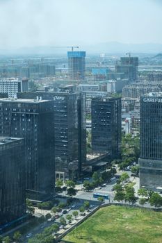 Stunning aerial view featuring modern skyscrapers and urban landscape in China.