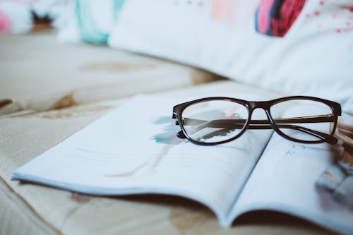 Free Black Framed Eyeglasses On Paper Stock Photo