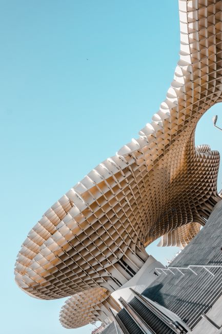 A stunning view of the Metropol Parasol structure in Seville against a clear blue sky.