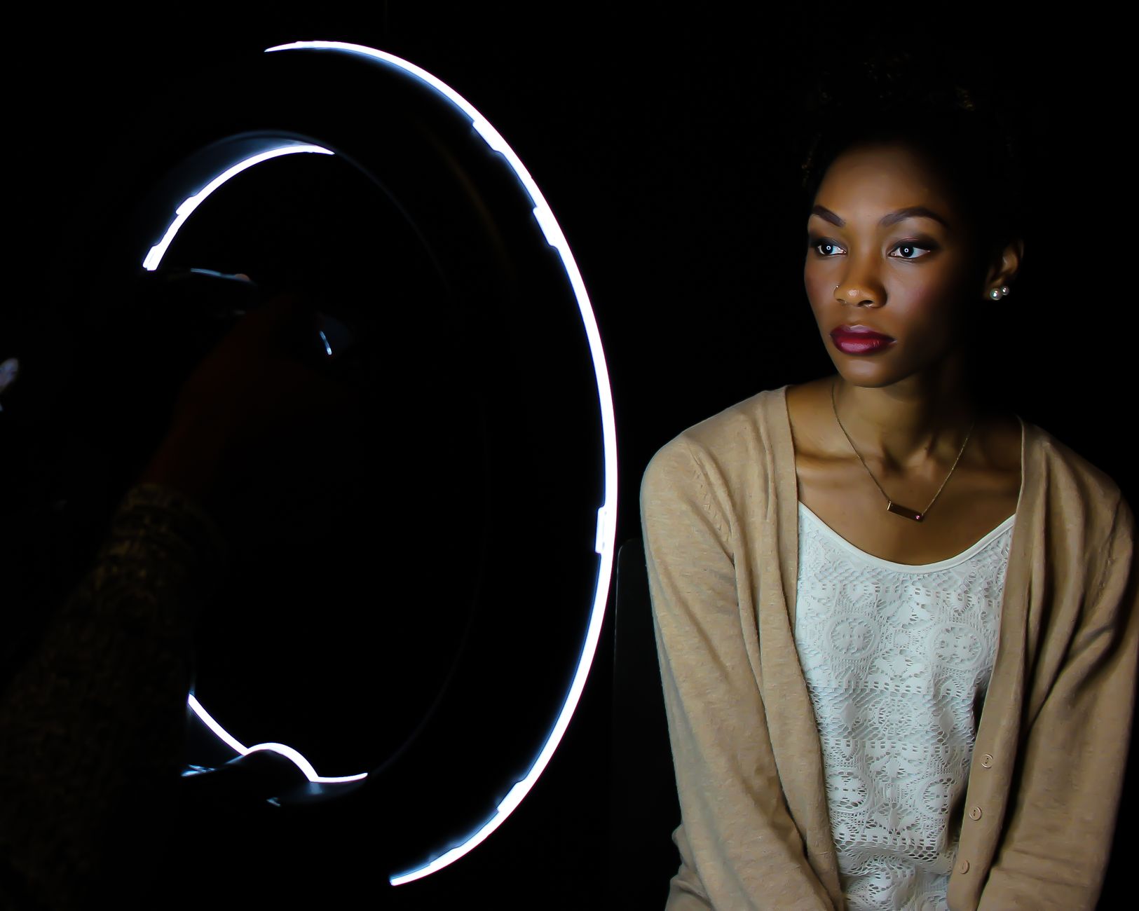 Portrait of a woman under dramatic lighting setup in studio.. portrait, woman, under