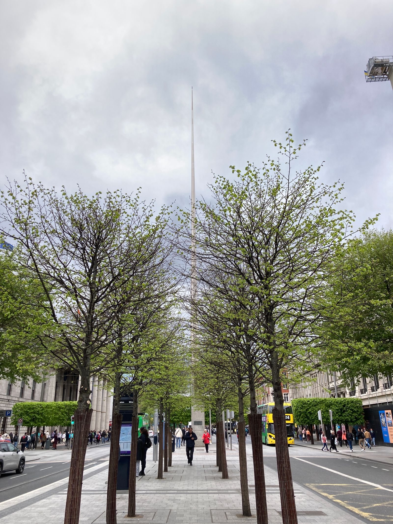 People walking near the Spire on O'Connell Street in Dublin