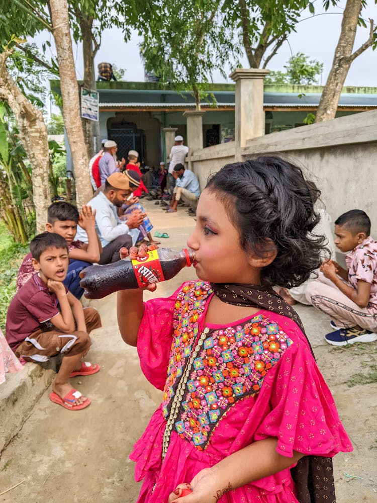 A Girl Drinking Soda