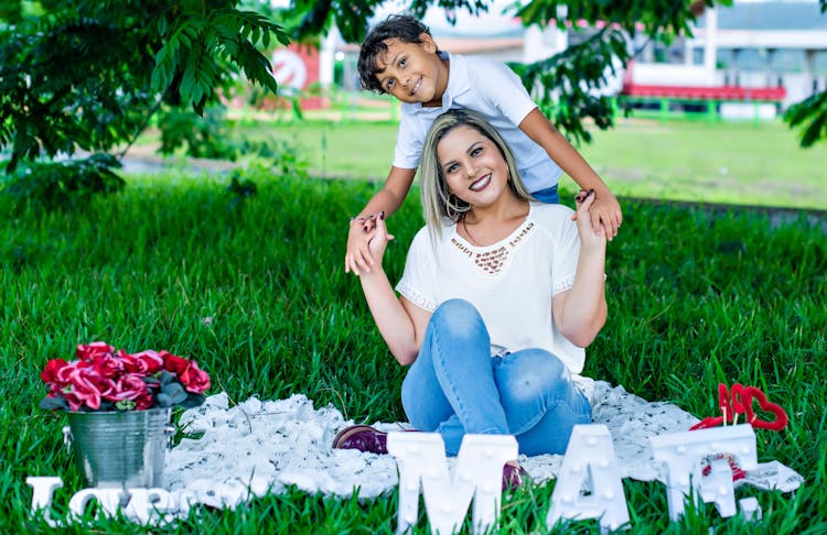 Mother And Son Smiling At The Camera