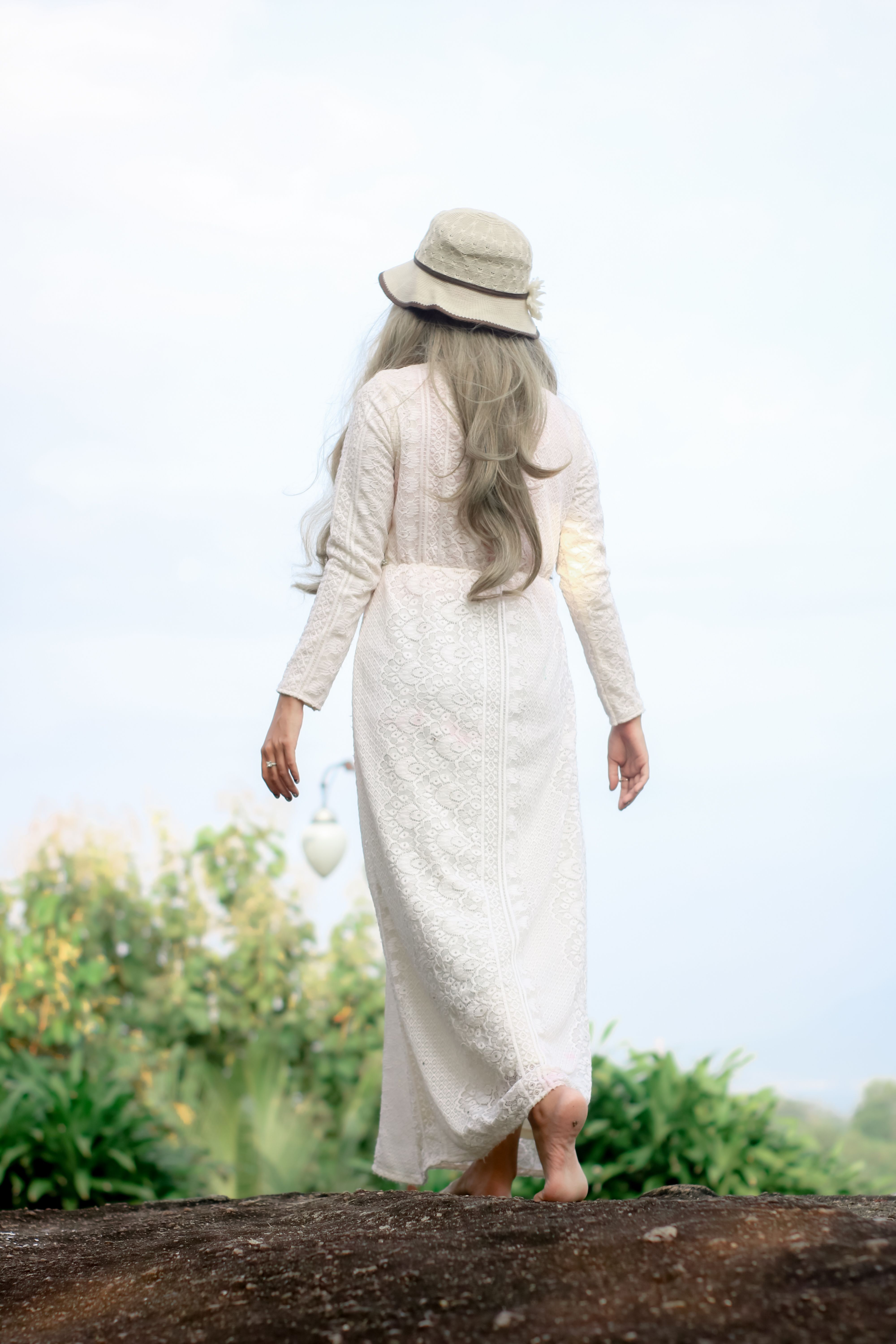 Woman in White Long Sleeve Dress Wearing White Hat · Free Stock Photo
