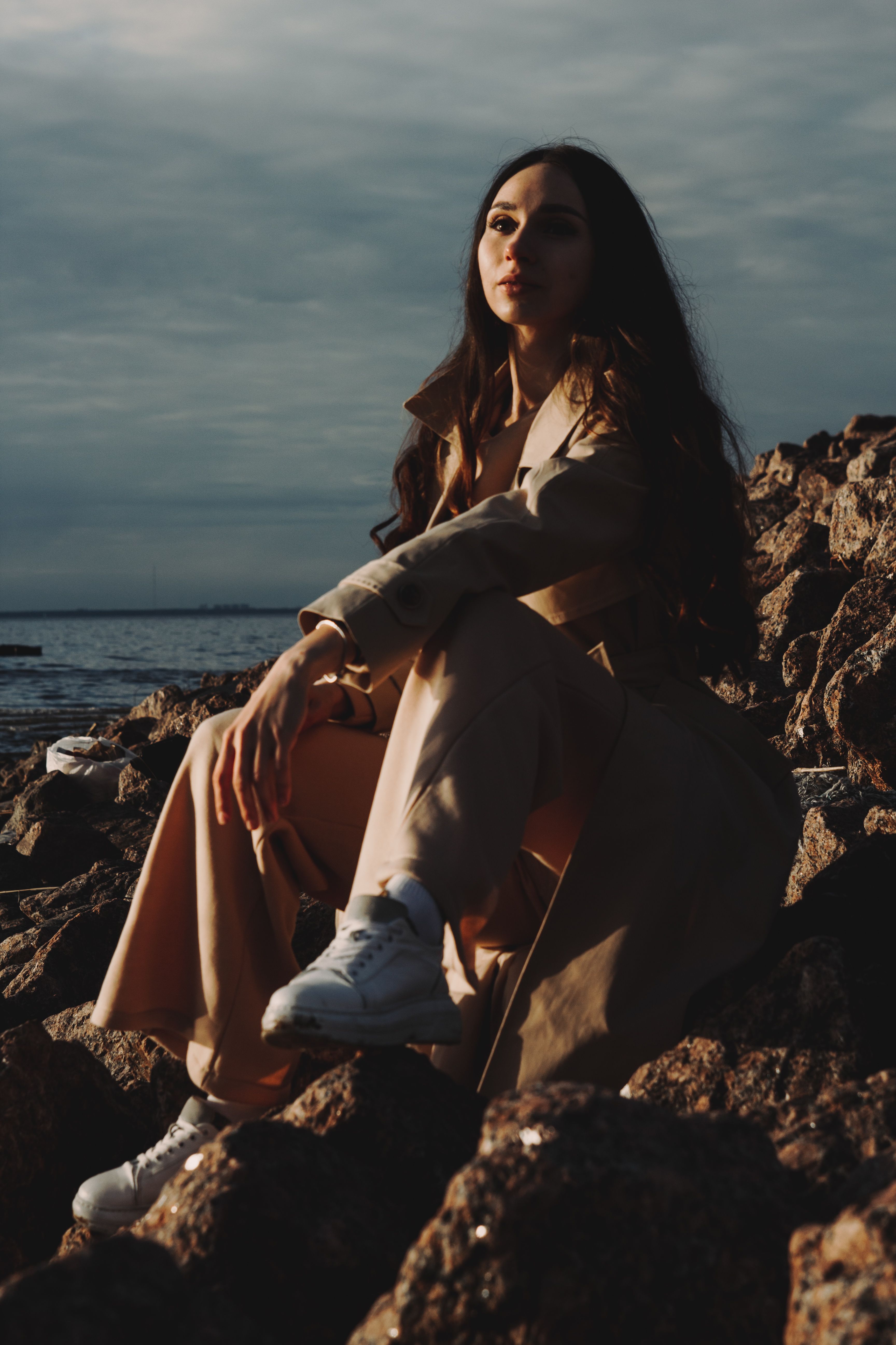 Woman Sitting on a Rock · Free Stock Photo