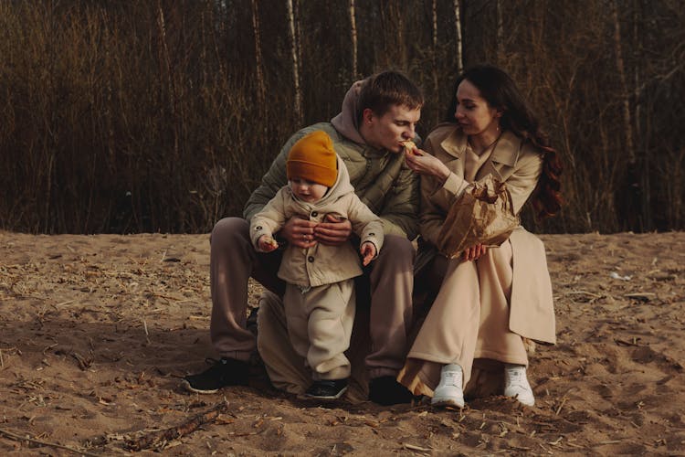 Family In Autumn In Outdoors