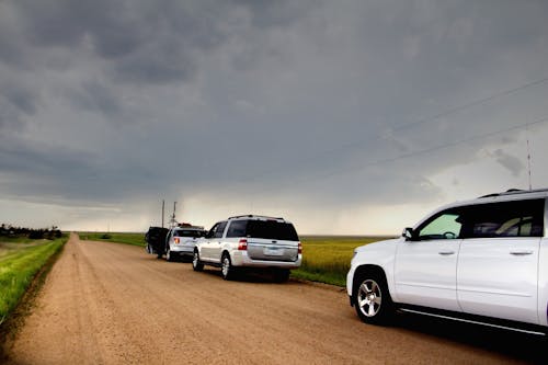 Free stock photo of clouds, dirt road, driving