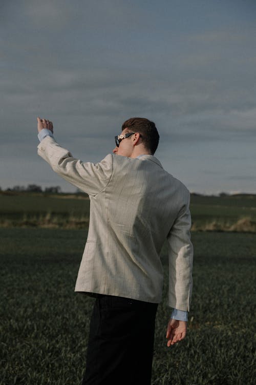 A Man Standing in a Field