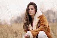 Photo of Woman Wearing Brown and Beige Coat