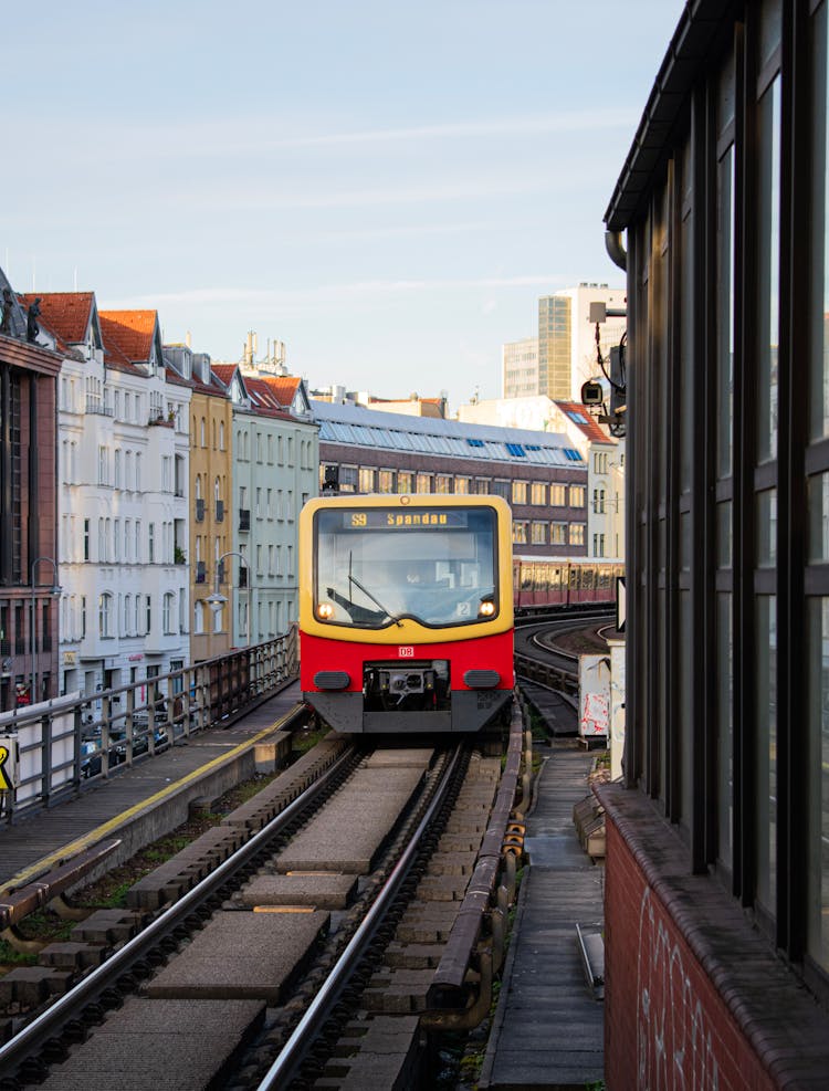 Yellow And Red Train On Rail Road