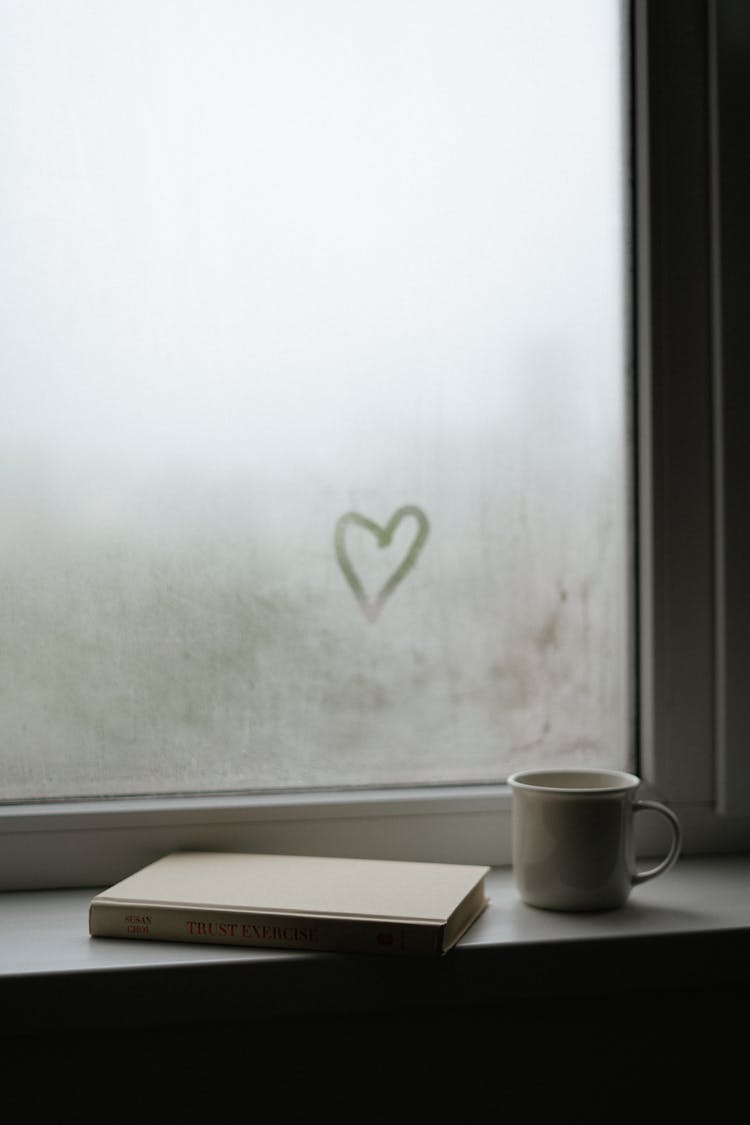 A Cup Near A Moist Window