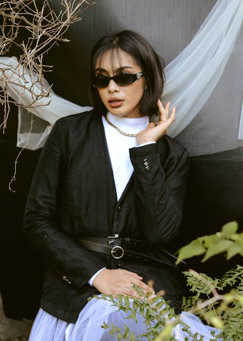 Free  Woman in Black Jacket Wearing Black Sunglasses Stock Photo