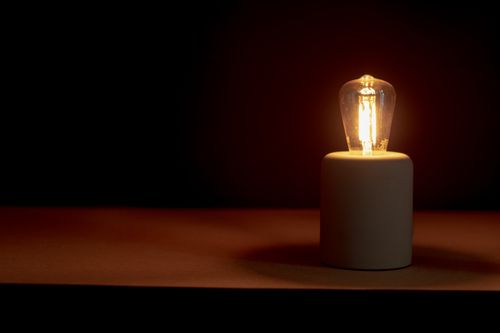 Free Creative ideas, lightbulb flashing in the dark Stock Photo