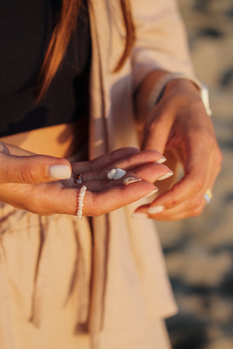 A Person Wearing Pearl Ring