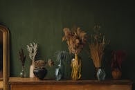 Brown and Green Plant on Black Ceramic Vase