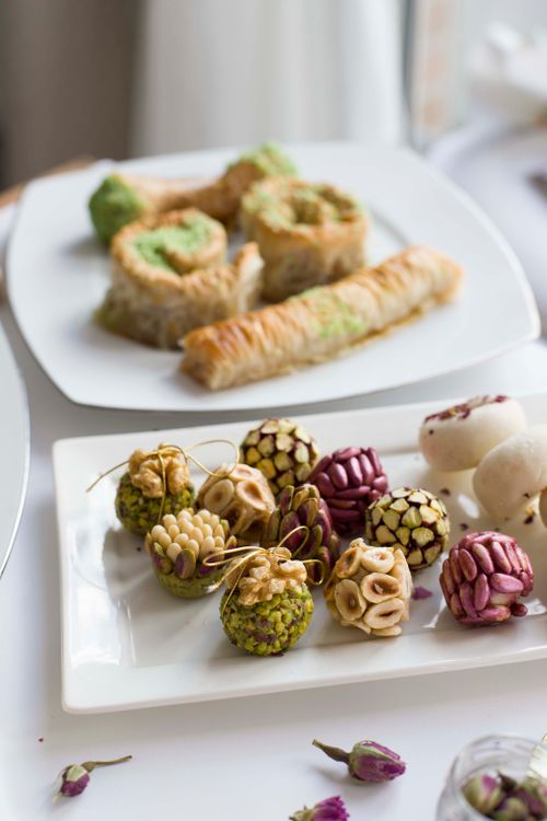 Free Assorted gourmet pastries on elegant plates, perfect for dessert lovers and culinary enthusiasts. Stock Photo