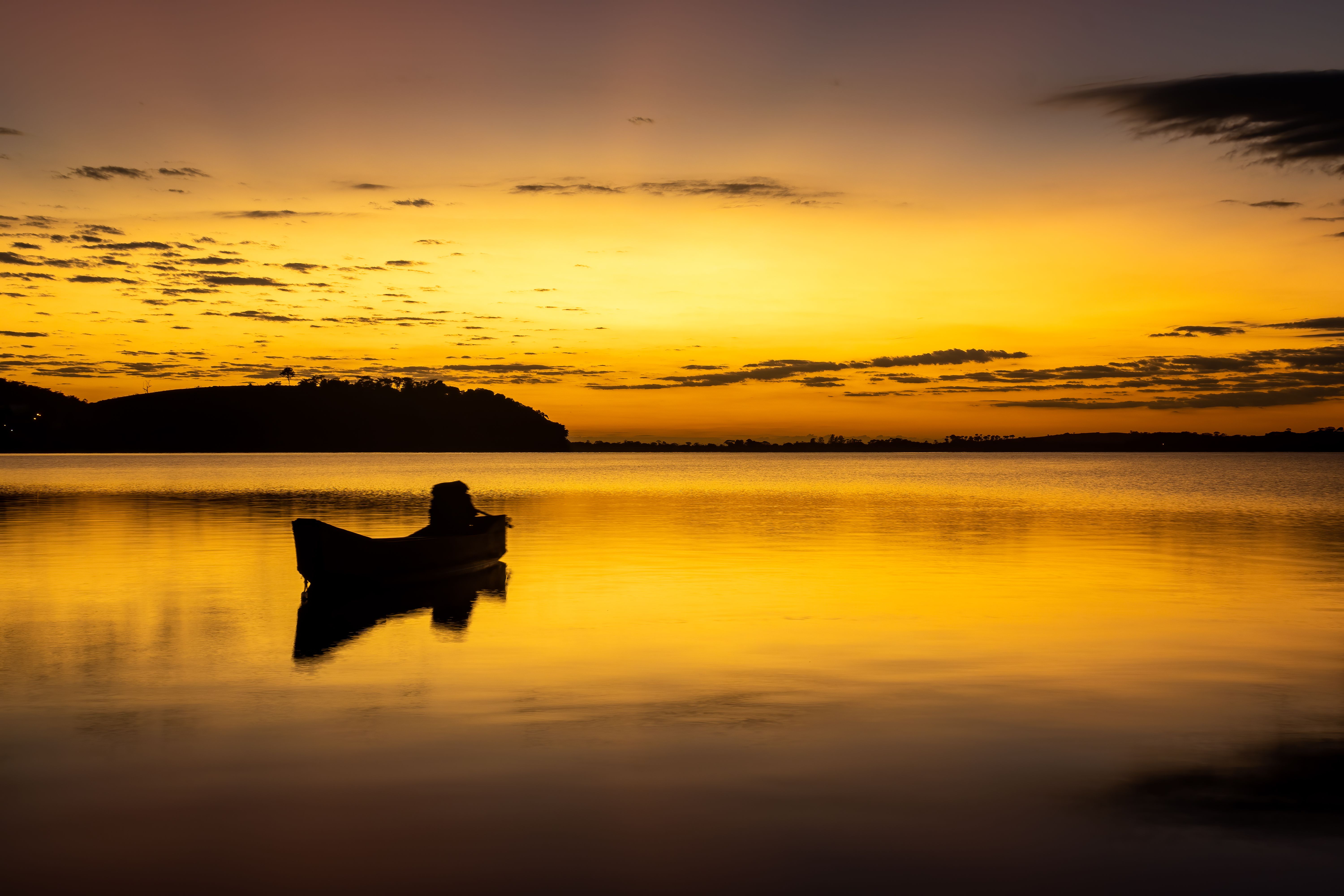 Silhouette of a Boat During Sunset · Free Stock Photo