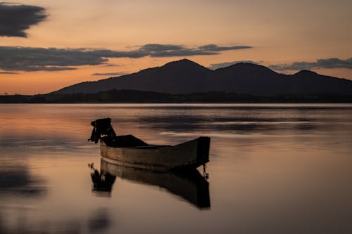 Wooden Boat Floating on the Lake