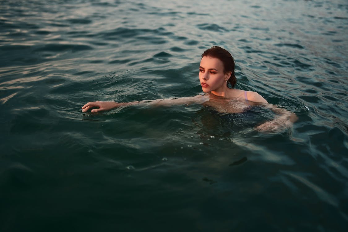 Beautiful Woman Swimming on Lake Water · Free Stock Photo