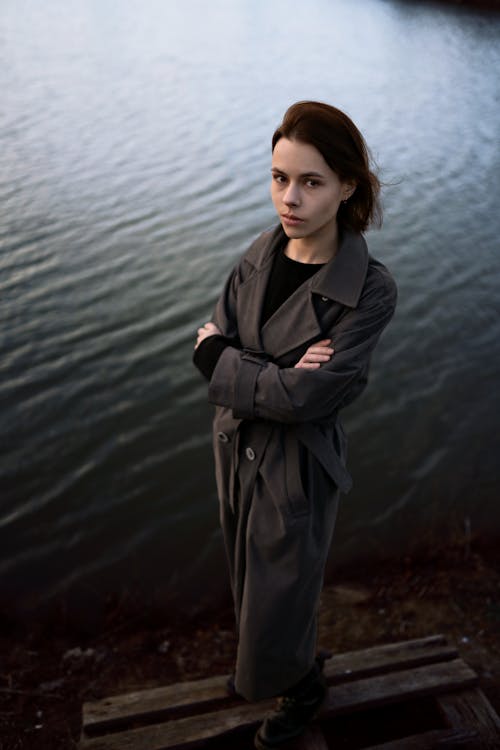 Pensive Brunette on Lake Shore