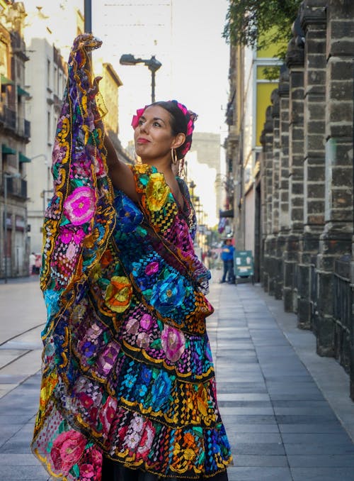 A Woman Wearing Colorful Traditional Dressing Posing Beautifully at the Side of the Street
