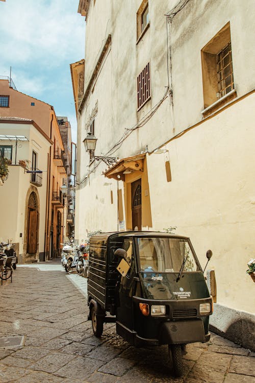 Vehicle Parked on Alley in Town