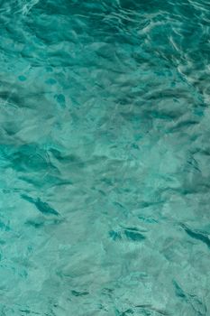 A serene view of turquoise ocean water with gentle ripples. Perfect for backgrounds or relaxation themes.
