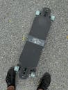 Black and Gray Skateboard on Gray Concrete Floor