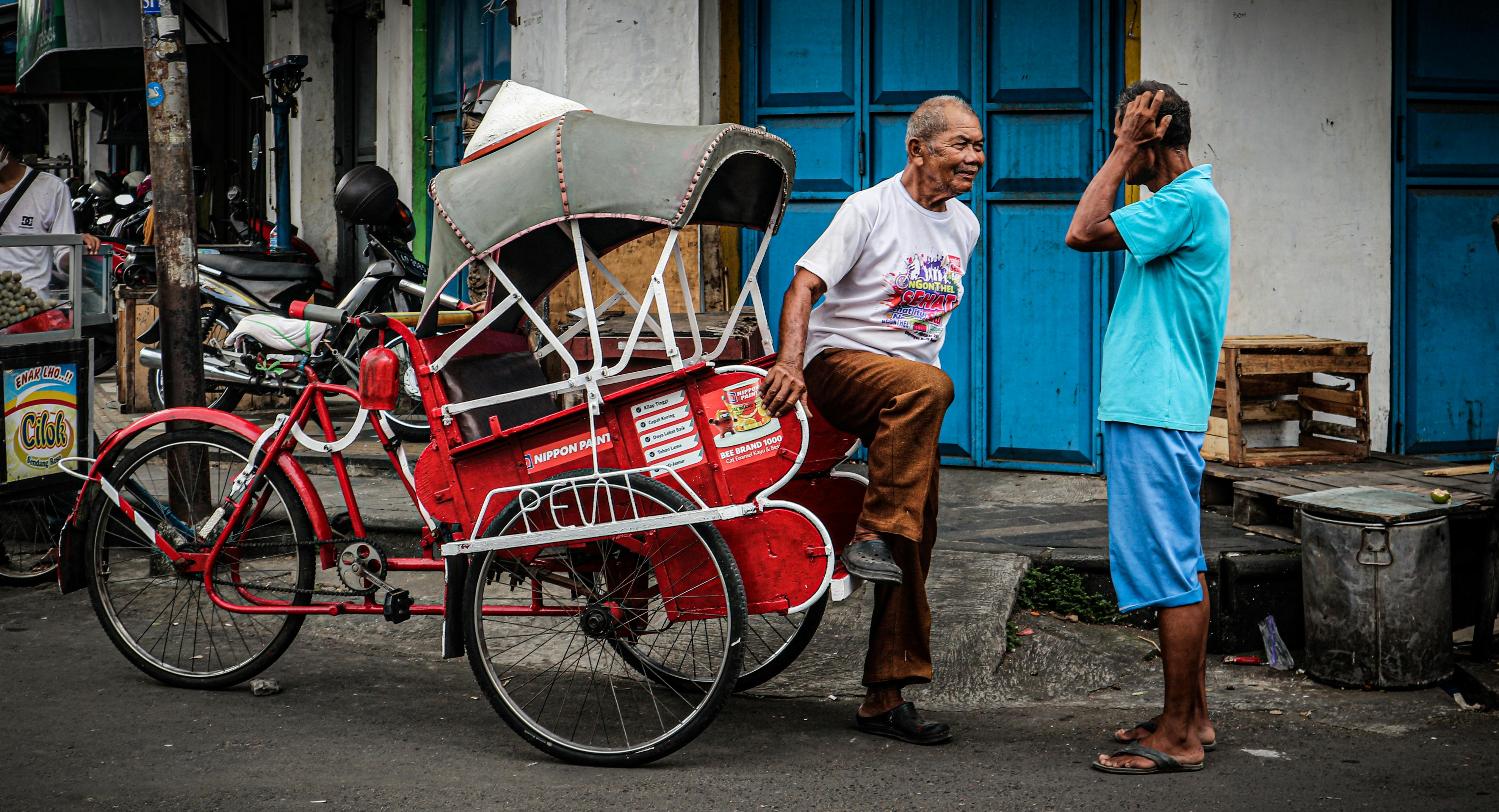 A Woman Riding A Rickshaw · Free Stock Photo