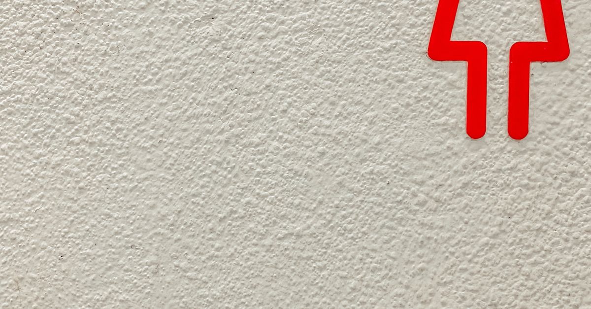 Woman Logo on White Rough Surface · Free Stock Photo