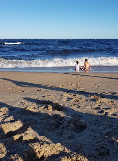 Fotos de stock gratuitas de amantes de la playa, arena, cielo azul