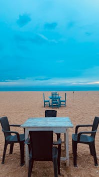 A tranquil dining scene on a sandy beach in Sri Lanka, perfect for a summer getaway.
