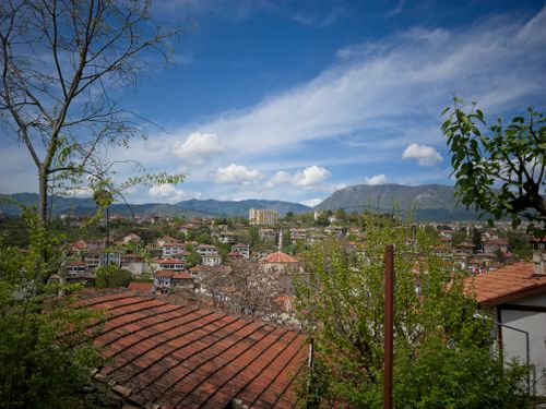 Free Explore the picturesque cityscape of Safranbolu featuring traditional Ottoman architecture under a clear blue sky. Stock Photo