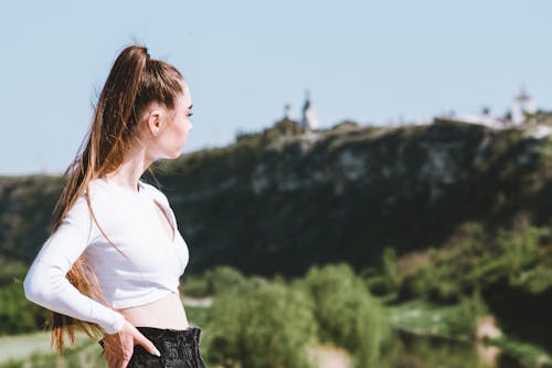 Woman in White Crop Top Looking Afar