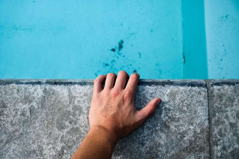 pool coping with bullnose edge showing safety features and cool-touch surface - pavers around swimming pool