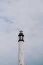 White and Black Lighthouse Under White Clouds