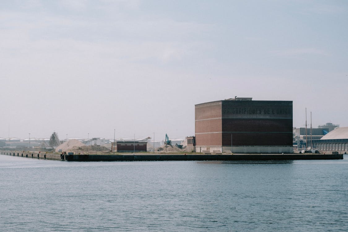 Clear Sky over Building on Shore in Town