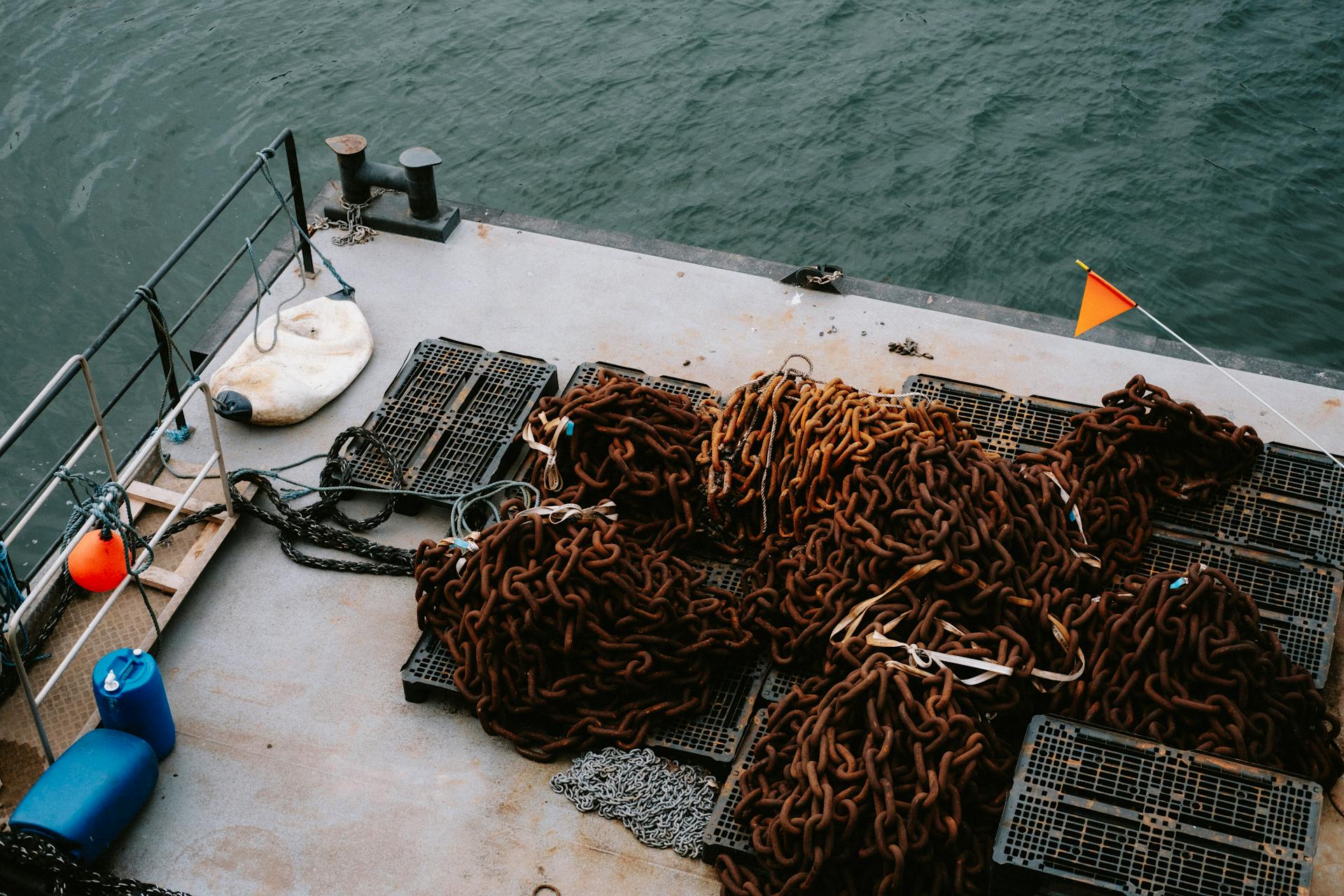 Rusty Chains on Platform on Water