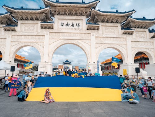 People Holding a Ukranian Flag Outside Liberty Square in Taipei