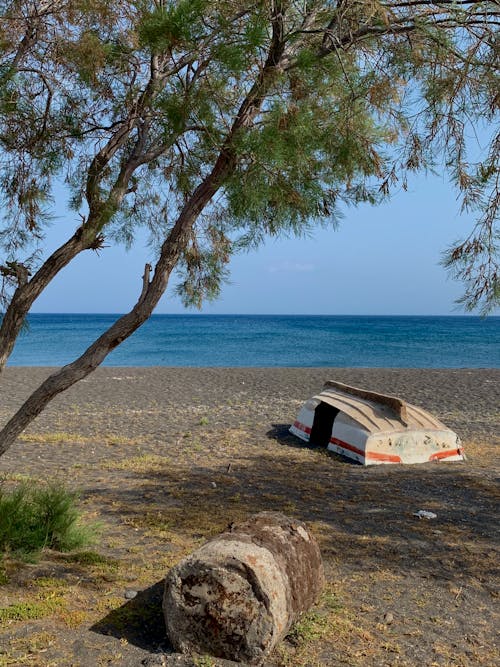 Wooden Boat on Beach Shore