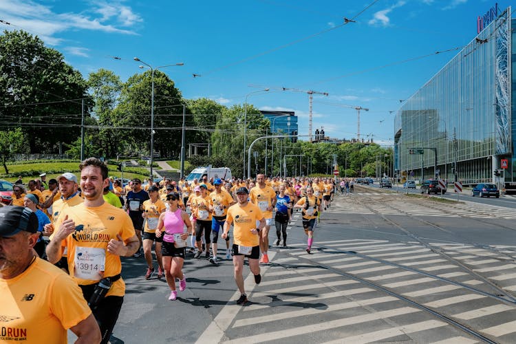 People Jogging On The Road