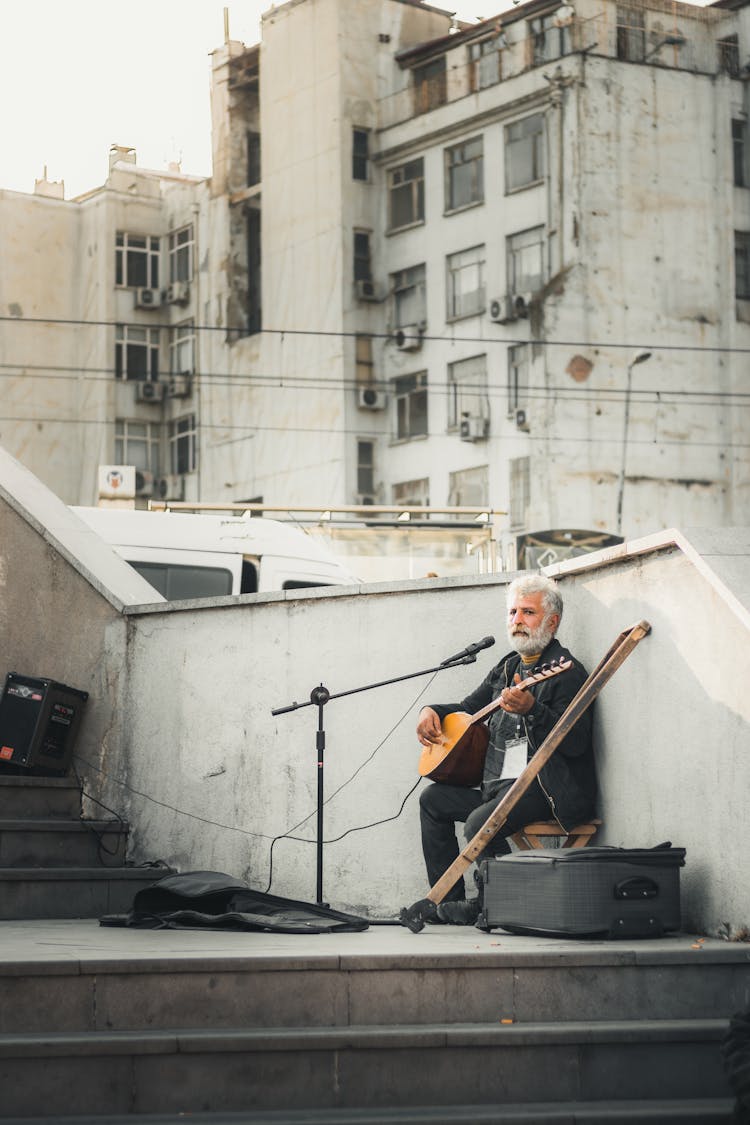 Old Bearded Man Playing On Street