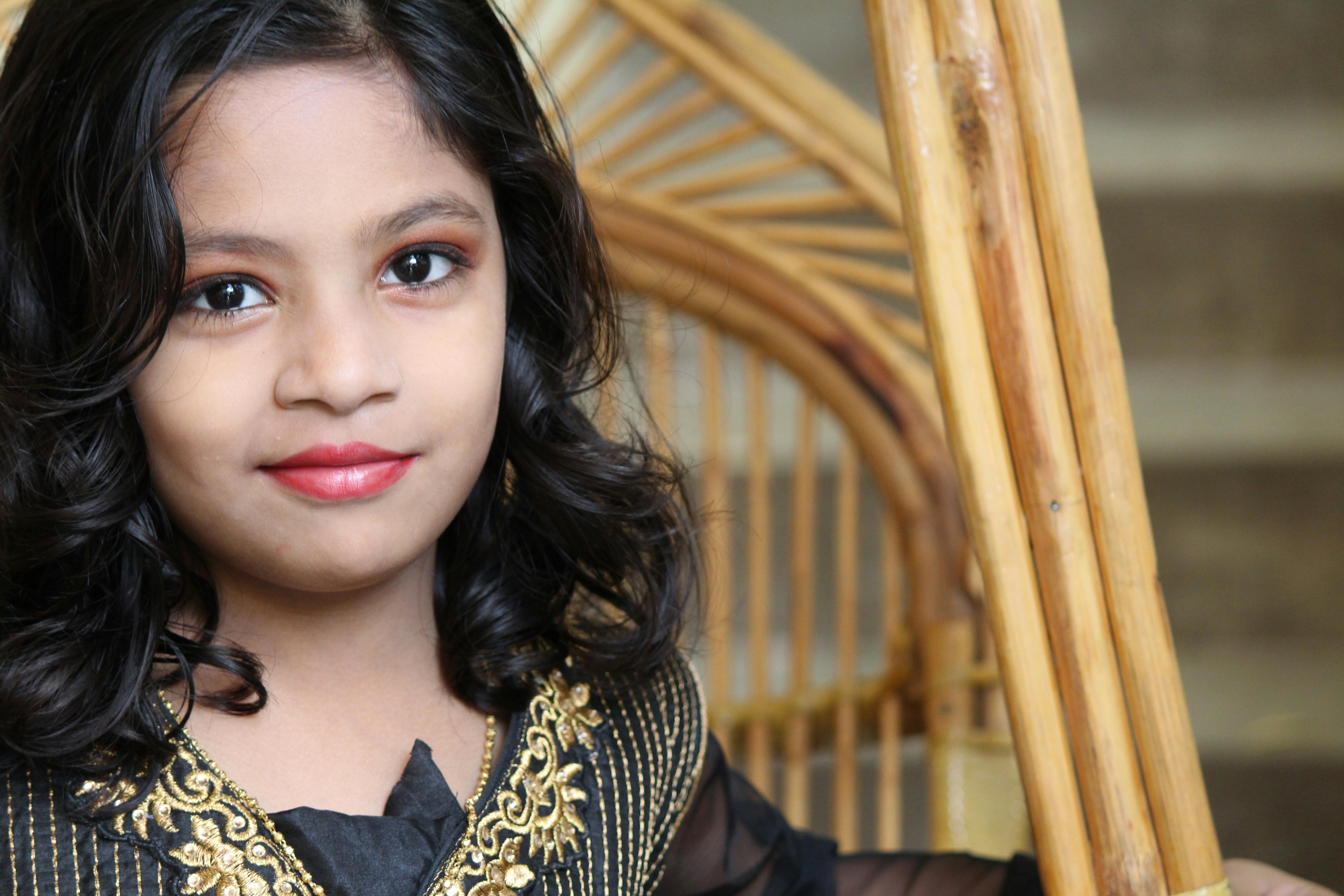 Girl Sitting on Rattan Chair · Free Stock Photo