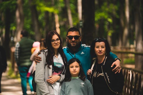 Free Family Posing Together at a Zoo Stock Photo