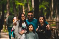 Family Posing Together at a Zoo